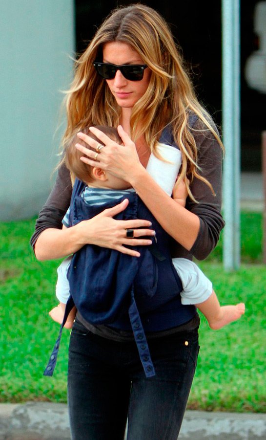 Photo du mannequin Gisele Bündchen avec un enfant